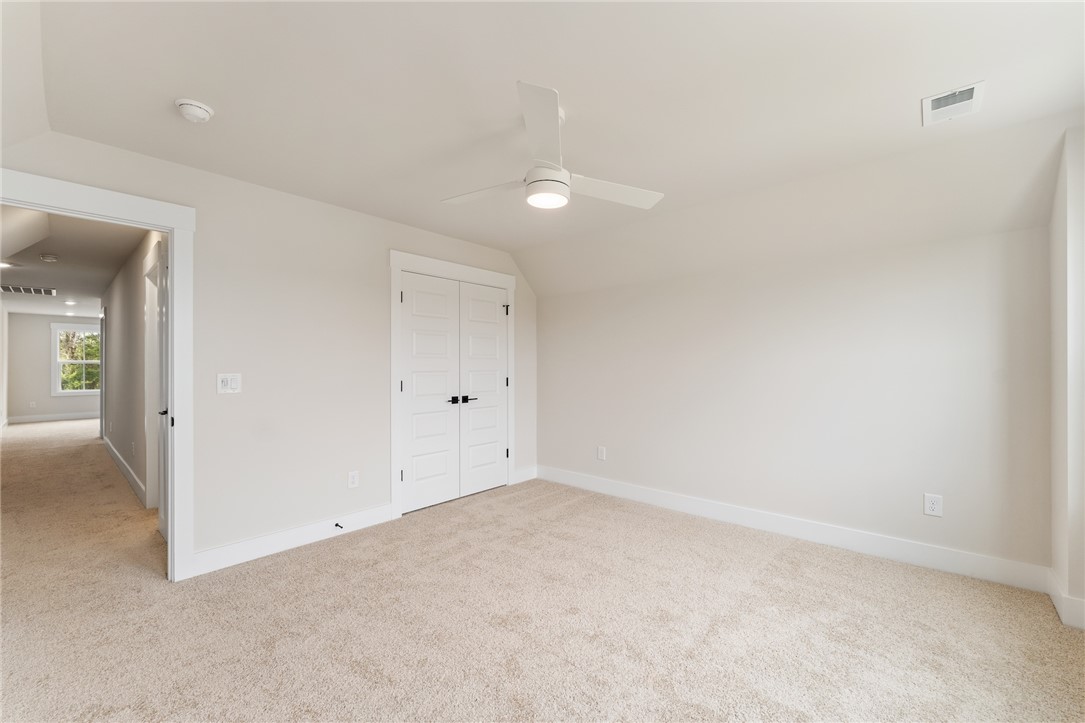 319 Summerall Drive Anderson, SC 29621 - Photo 34 of 37 This airy bedroom offers comfortable carpet flooring and ample natural light, creating a serene personal retreat.