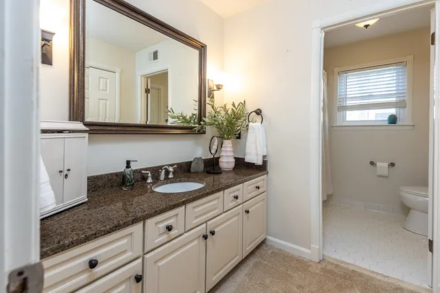 a backyard of a house with yard and outdoor seating