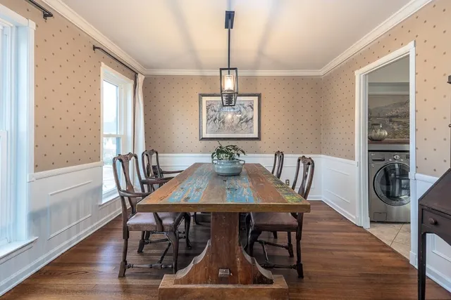 a view of a dining room with furniture window and wooden floor