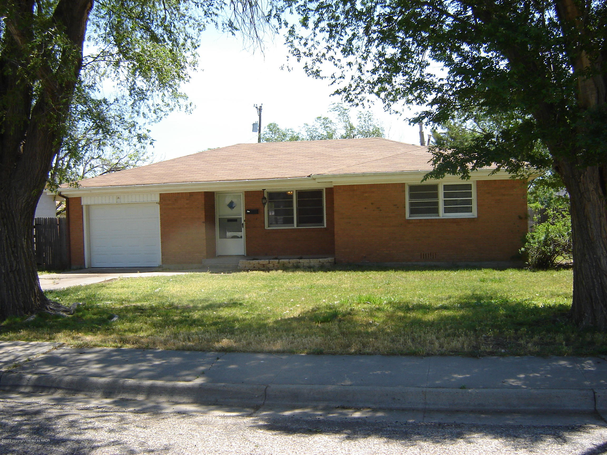 4013 Crockett Street Amarillo, TX 79110 - Photo 1 of 28 a front view of a house with garden