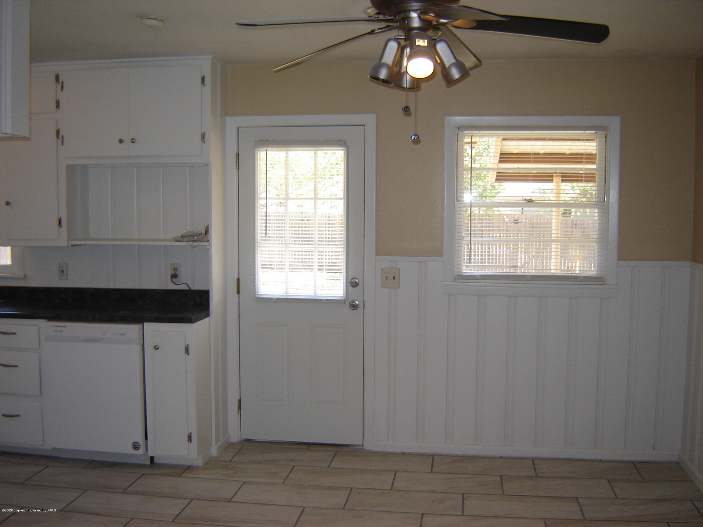 4013 Crockett Street Amarillo, TX 79110 - Photo 10 of 28 a view of an empty room with a window