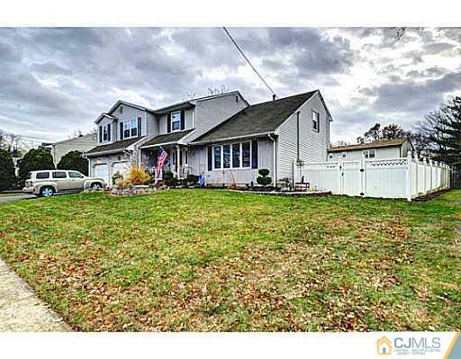 119 Dover Road Colonia, NJ 07067 - Photo 1 of 25 a front view of a house with garden