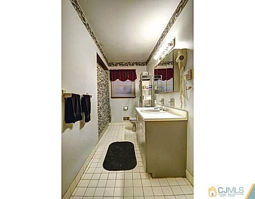119 Dover Road Colonia, NJ 07067 - Photo 17 of 25 a utility room with dryer and washer