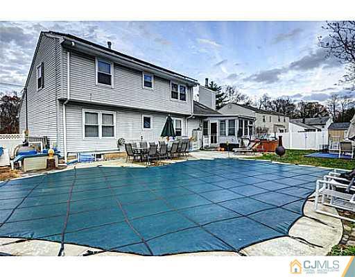 119 Dover Road Colonia, NJ 07067 - Photo 22 of 25 a swimming pool view with a seating space