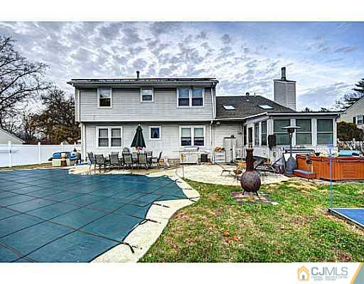 119 Dover Road Colonia, NJ 07067 - Photo 23 of 25 a front view of a house with swimming pool yard and outdoor seating