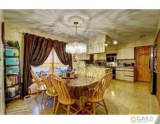 119 Dover Road Colonia, NJ 07067 - Photo 5 of 25 a view of a dining room with furniture