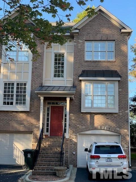 1347 Cameron View Court Raleigh, NC 27607 - Photo 1 of 23 a front view of a house with garage