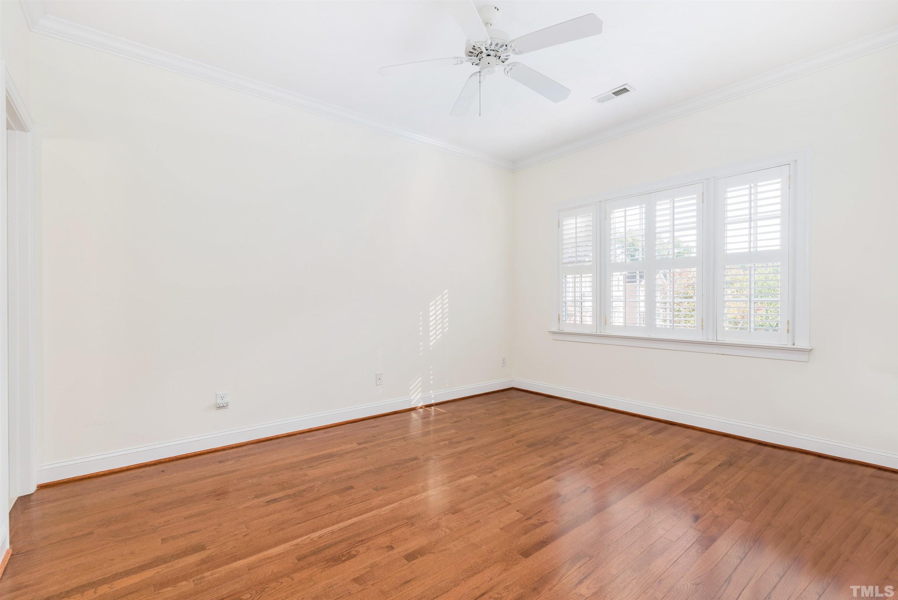 1347 Cameron View Court Raleigh, NC 27607 - Photo 23 of 23 wooden floor in an empty room with a window