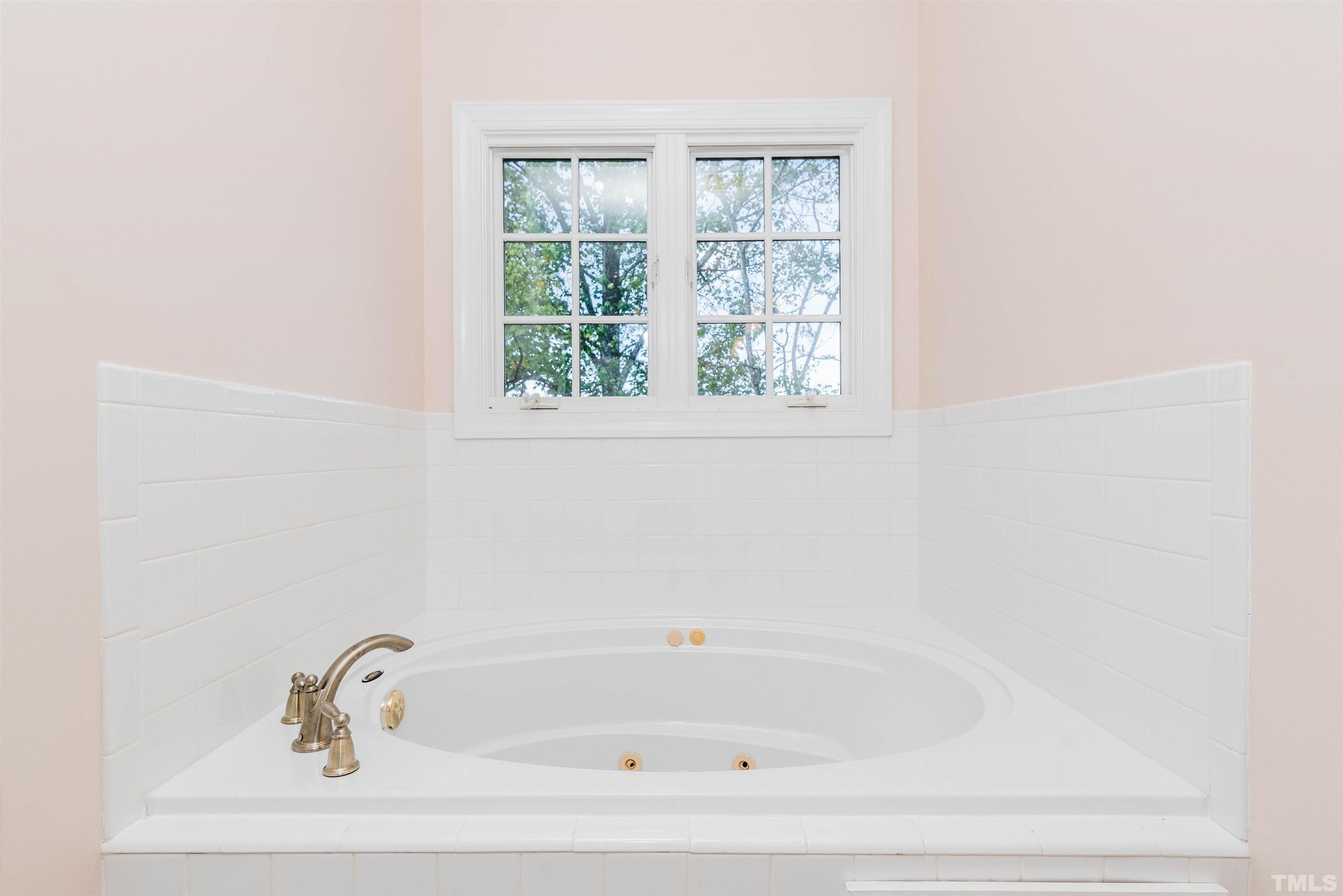 1347 Cameron View Court Raleigh, NC 27607 - Photo 5 of 23 a white bath tub and a window