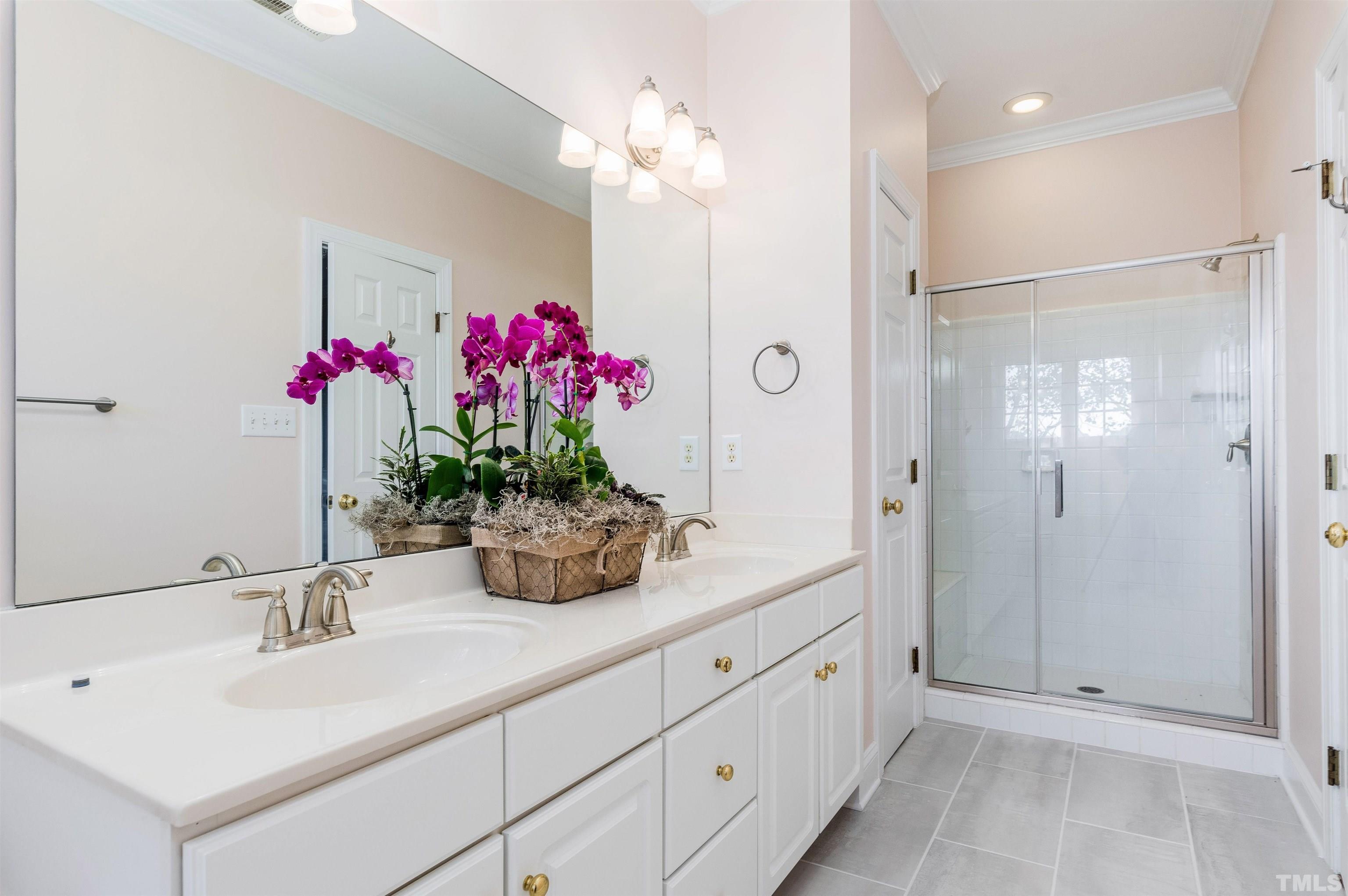 1347 Cameron View Court Raleigh, NC 27607 - Photo 6 of 23 a bathroom with a shower sink vanity granite and shower