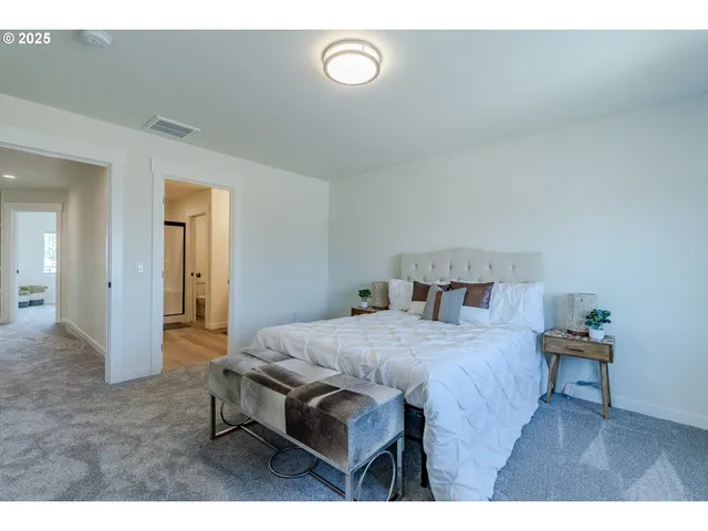 a bed room with a bed and a table