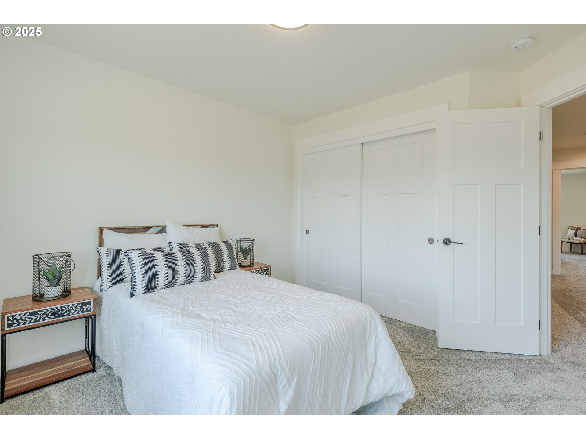 729 Periander Way Harrisburg, OR 97446 - Photo 16 of 24 a bedroom with a bed and a night stand