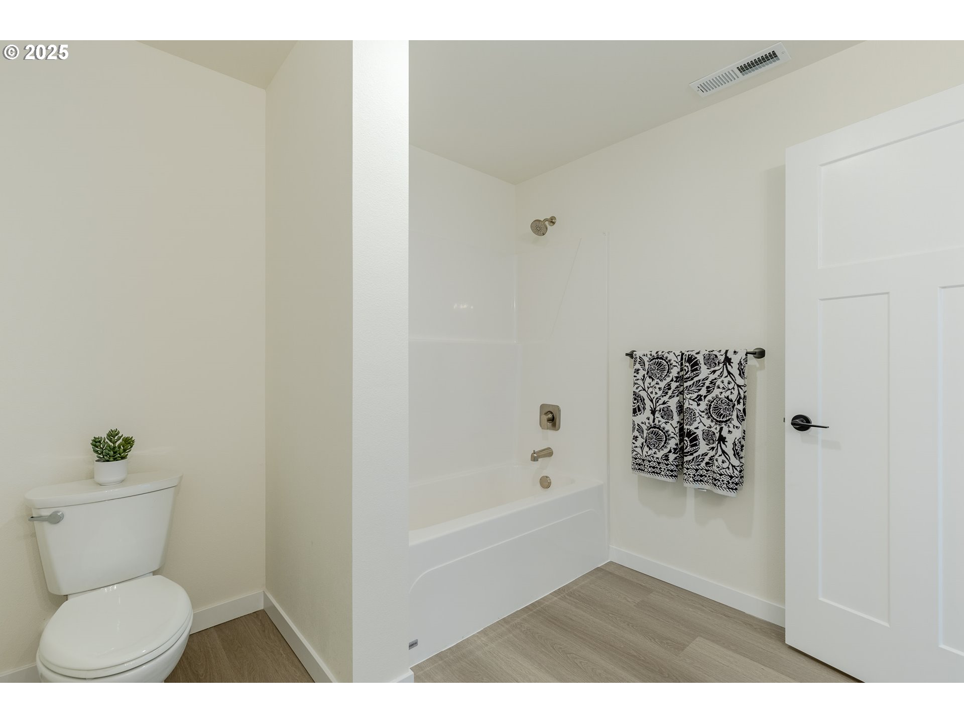 729 Periander Way Harrisburg, OR 97446 - Photo 18 of 24 a bathroom with a toilet and a shower curtain