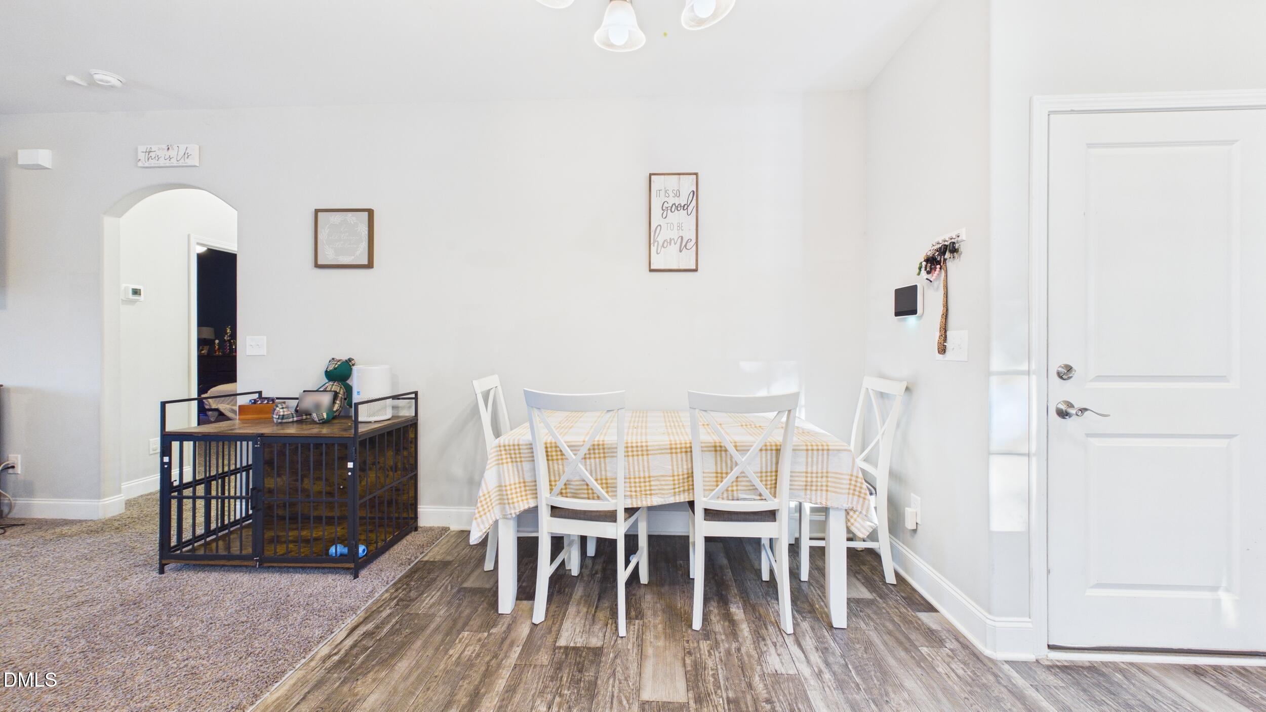 5930 Old 421 Road Liberty, NC 27298 - Photo 10 of 42 a view of a dining room with furniture and wooden floor