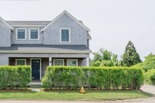 a view of a dinning table and chairs in patio of the house