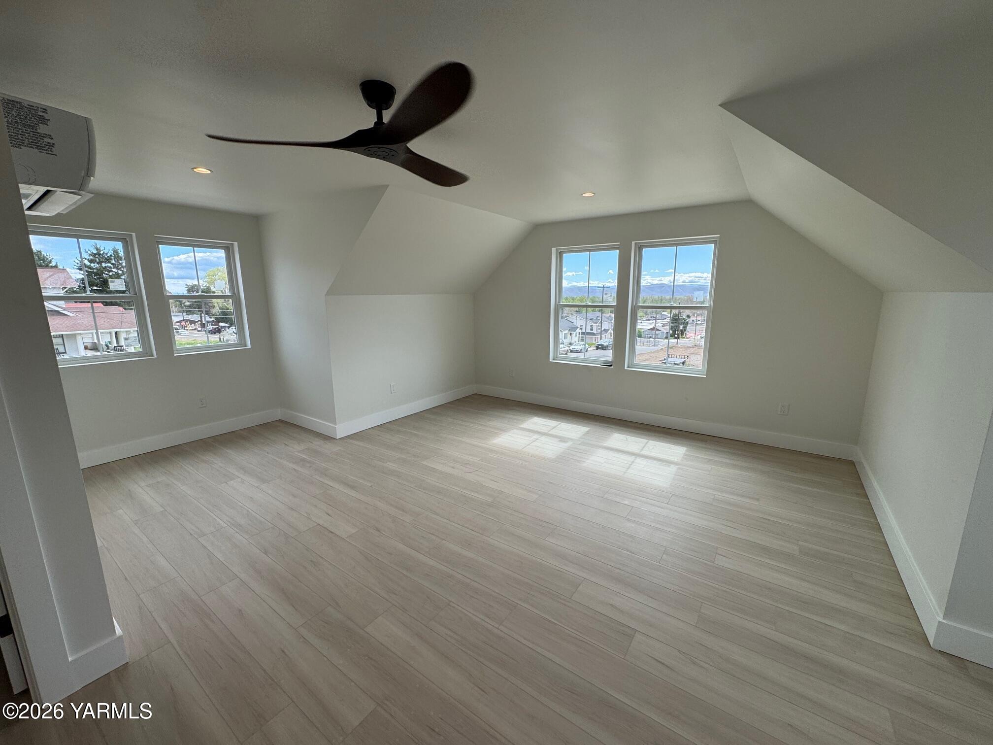 304 6th Street Zillah, WA 98953 - Photo 17 of 29 a view of an empty room with wooden floor and a window