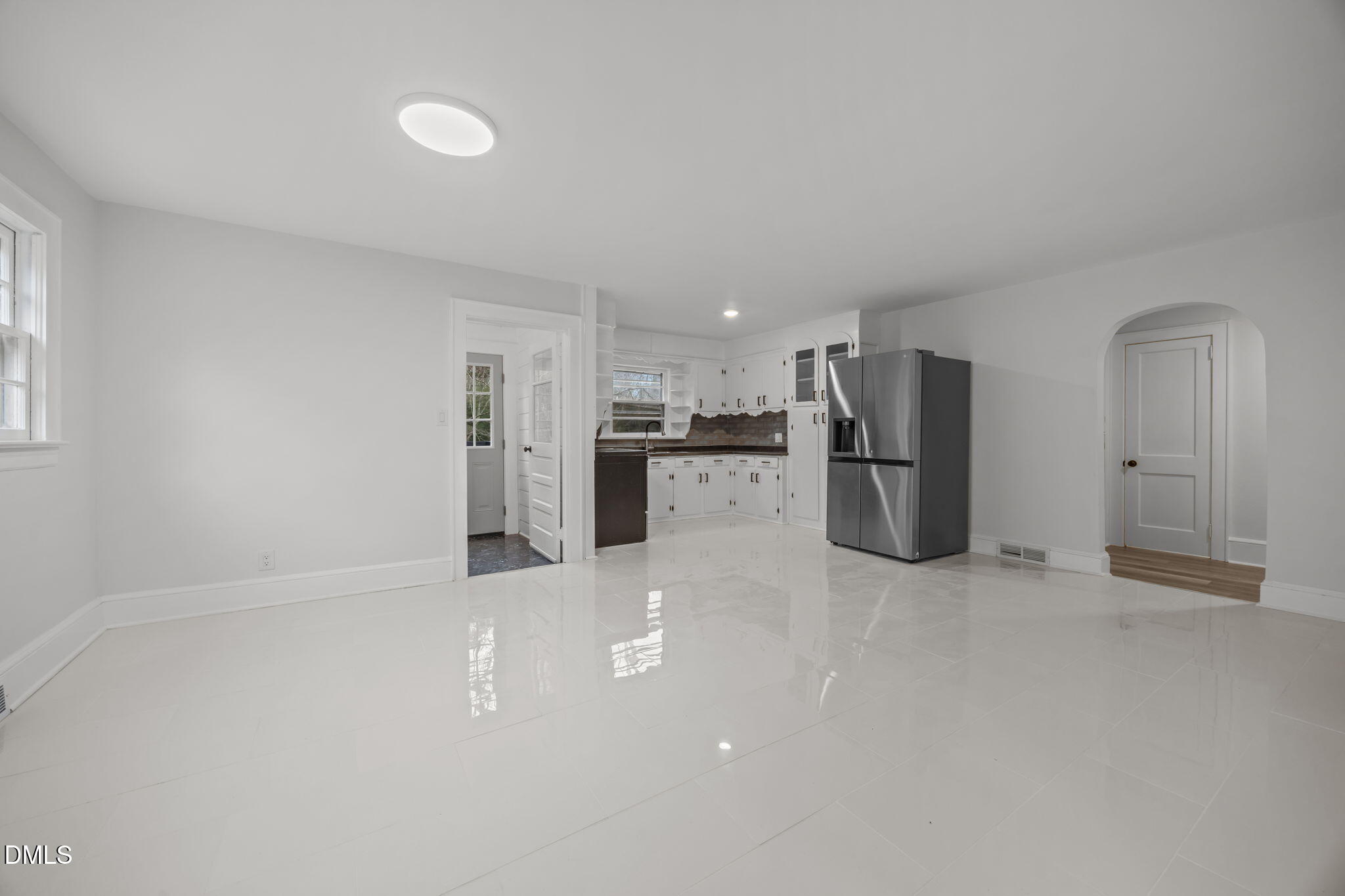1811 Lazy Lane High Point, NC 27265 - Photo 12 of 44 a view of a kitchen with refrigerator and wooden floor