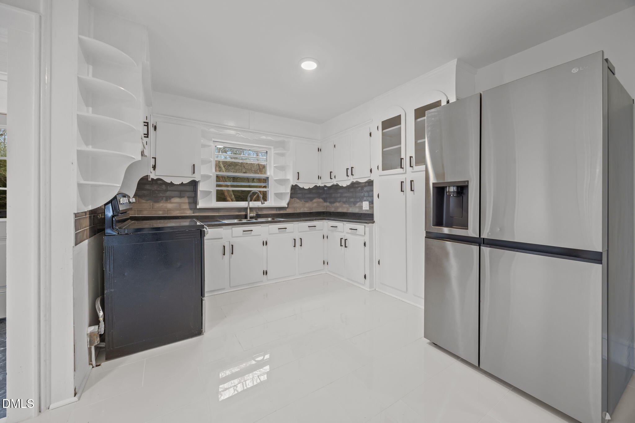 1811 Lazy Lane High Point, NC 27265 - Photo 17 of 44 a kitchen with granite countertop a refrigerator and a sink