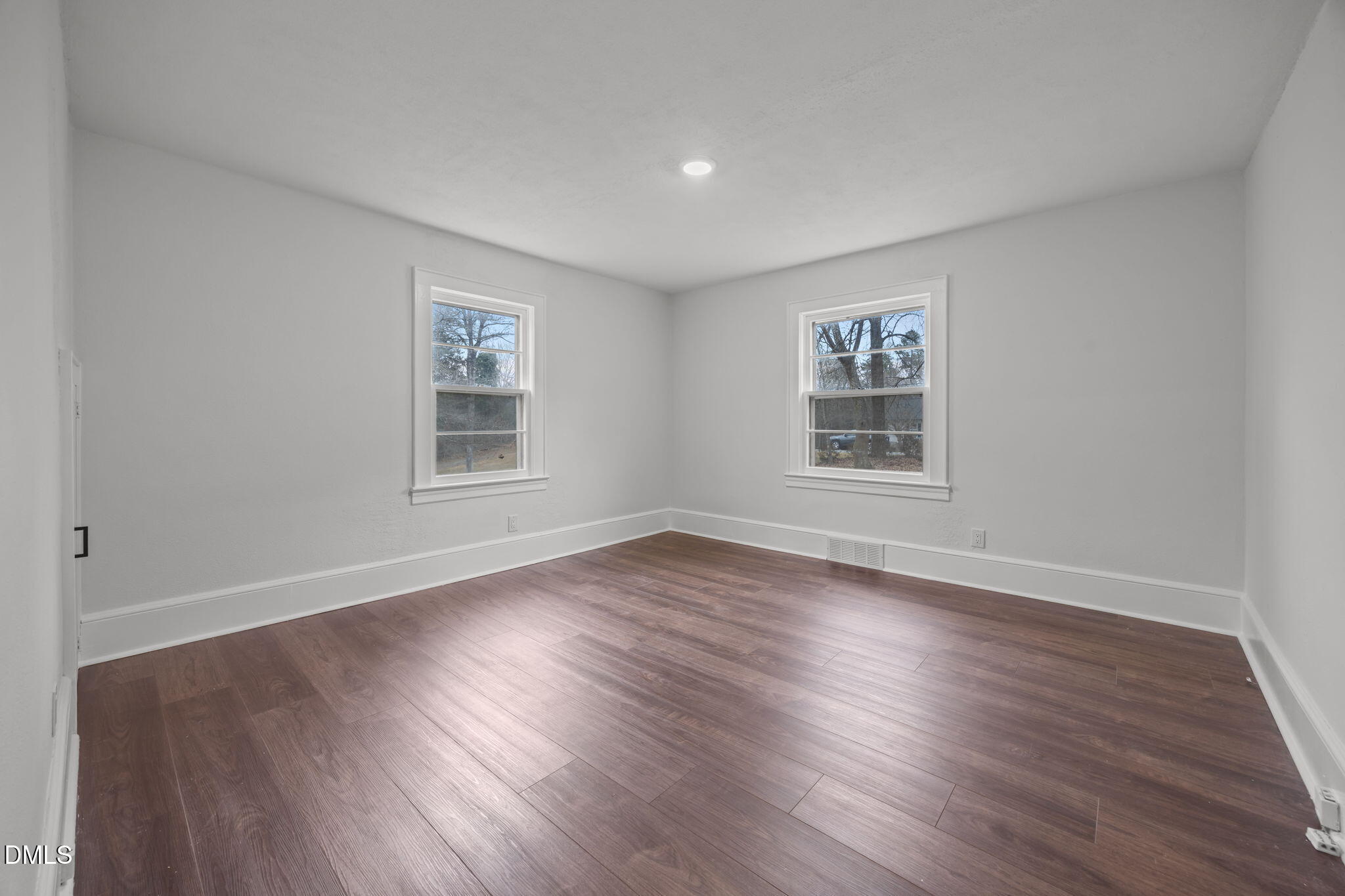 1811 Lazy Lane High Point, NC 27265 - Photo 23 of 44 a view of an empty room with wooden floor and a window