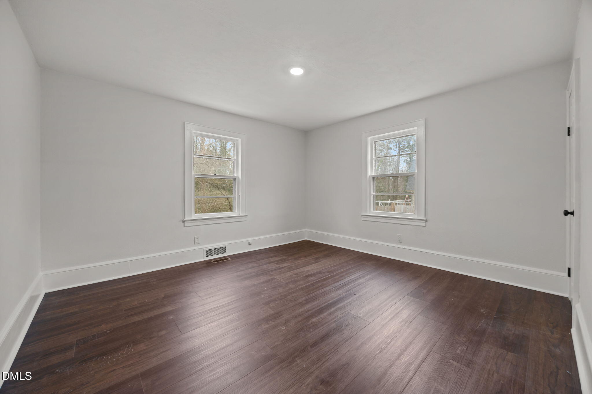 1811 Lazy Lane High Point, NC 27265 - Photo 26 of 44 a view of an empty room with wooden floor and a window
