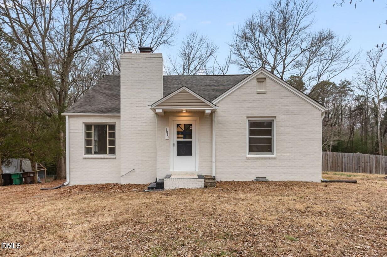 1811 Lazy Lane High Point, NC 27265 - Photo 2 of 44 a front view of a house with a yard and garage
