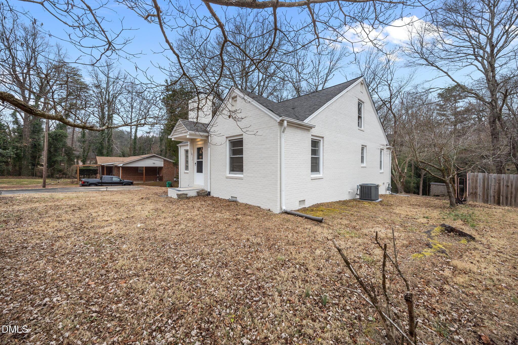 1811 Lazy Lane High Point, NC 27265 - Photo 42 of 44 a front view of a house with a yard covered in snow