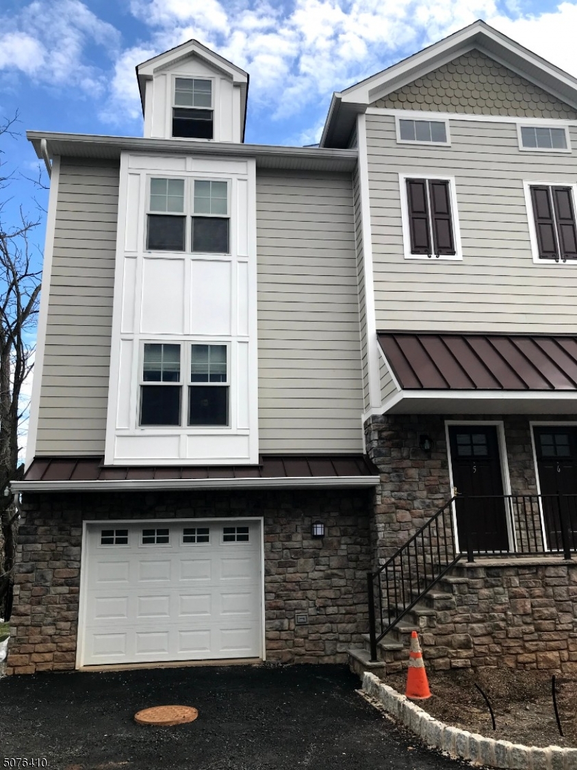 569 Springfield Avenue, Unit 5 Berkeley Heights, NJ 07922 - Photo 1 of 12 a front view of a house with parking