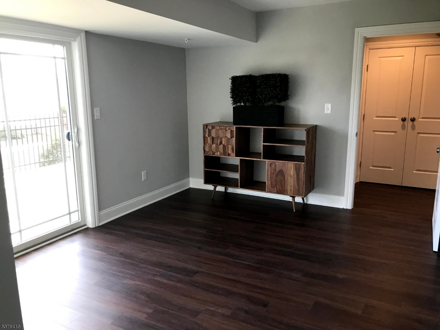 569 Springfield Avenue, Unit 5 Berkeley Heights, NJ 07922 - Photo 12 of 12 wooden floor in an empty room with a window