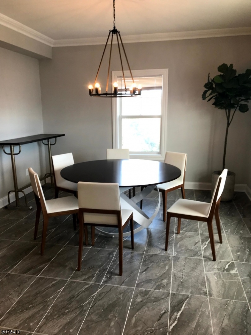 569 Springfield Avenue, Unit 5 Berkeley Heights, NJ 07922 - Photo 4 of 12 a dining room with furniture and window