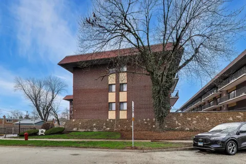 a view of a car parked in front of a building