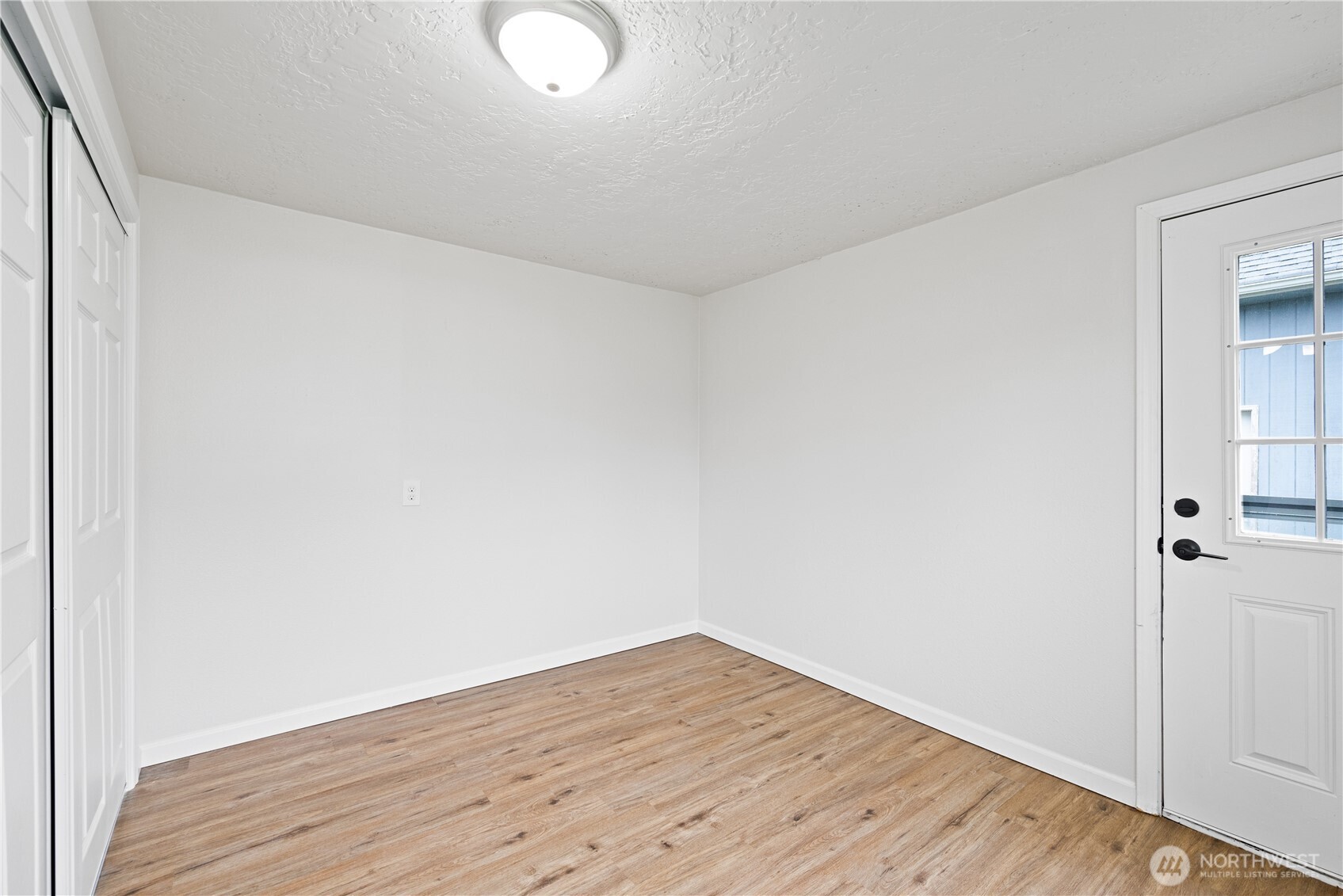 316 15th Avenue Longview, WA 98632 - Photo 14 of 30 a view of an empty room with wooden floor