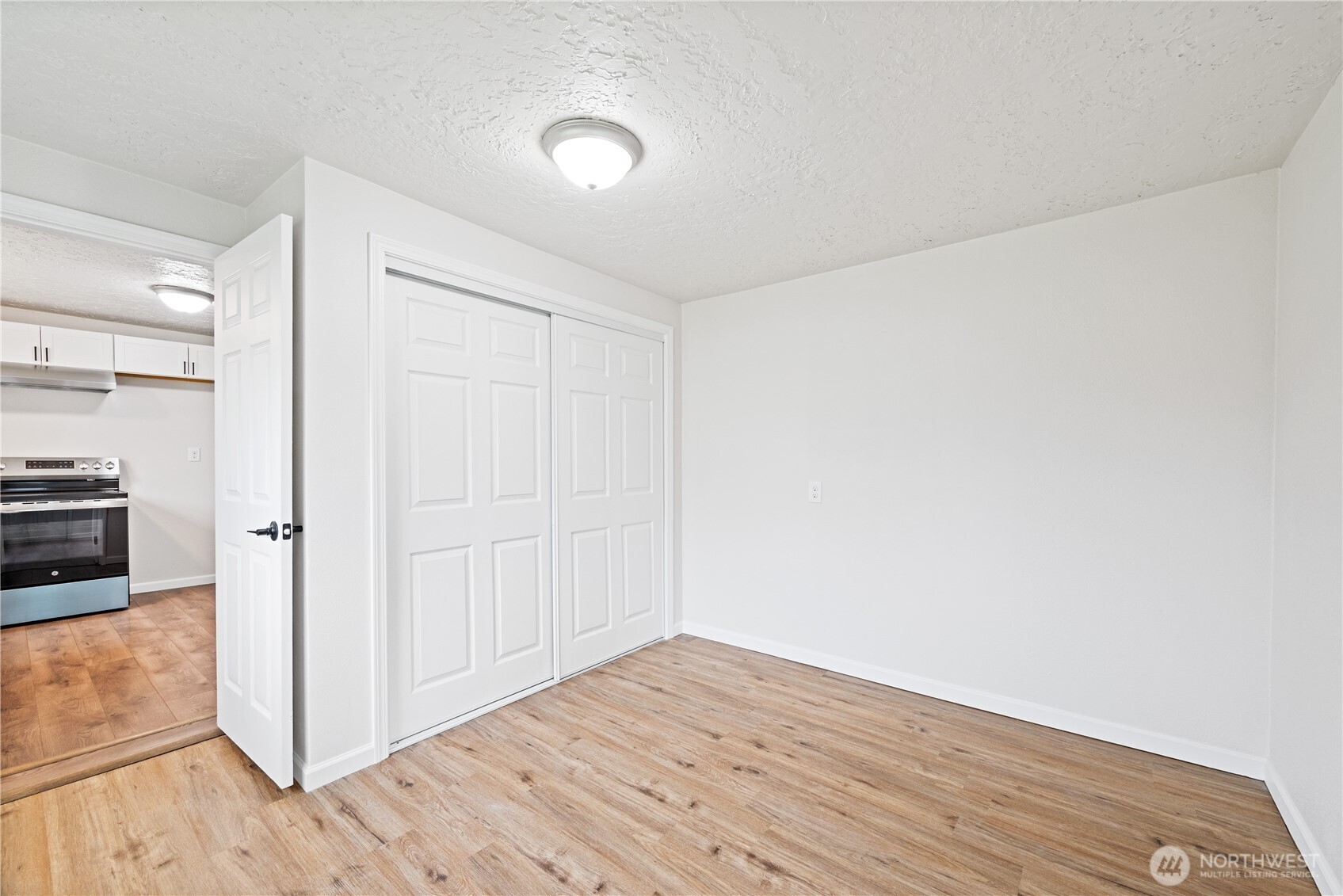 316 15th Avenue Longview, WA 98632 - Photo 15 of 30 a view of a kitchen with wooden floor