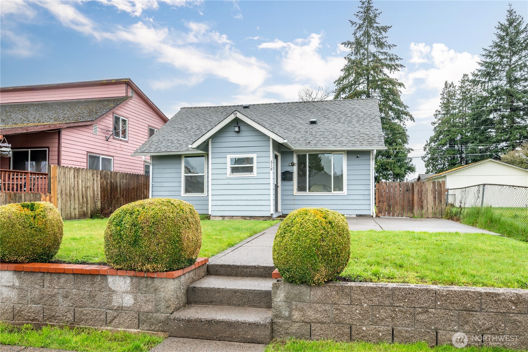 316 15th Avenue Longview, WA 98632 - Photo 2 of 30 a view of a house with a yard and plants