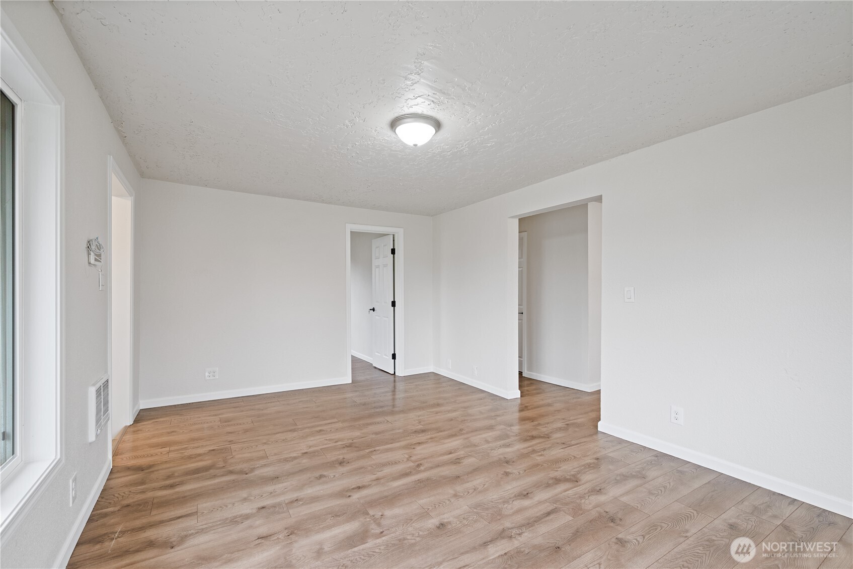 316 15th Avenue Longview, WA 98632 - Photo 8 of 30 a view of an empty room with wooden floor