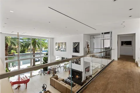 a view of roof deck with two chairs and a table