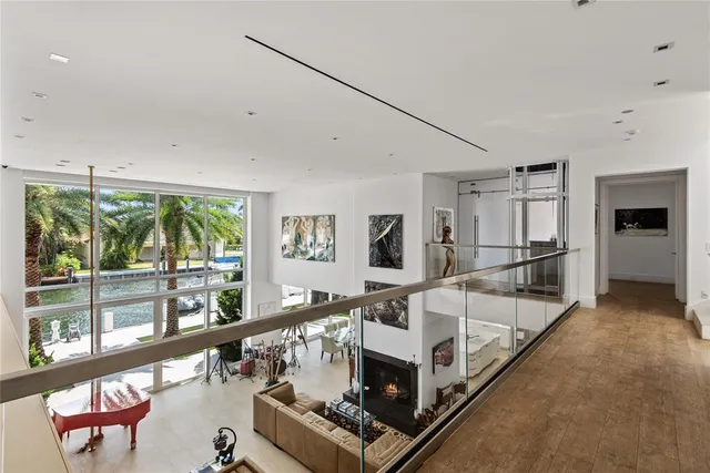a view of a floor to ceiling window and potted plants