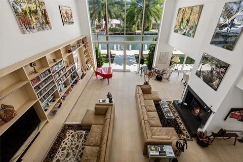 a view of a lake with boats and trees all around