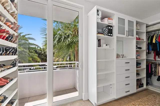 a bathroom with a sink mirror and shower