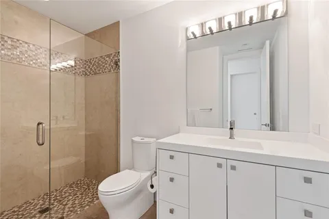 front view of a house with a yard and potted plants