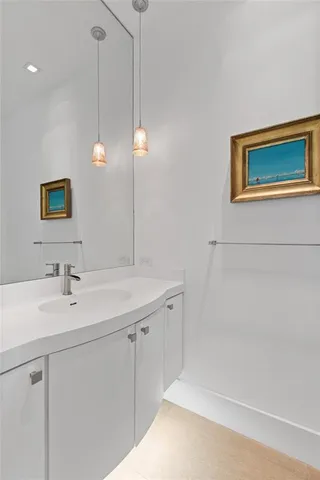 a swimming pool with outdoor seating and city view