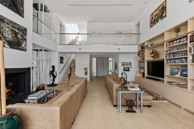 a view of a dining room with furniture water view and backyard of the house