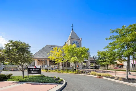 a front view of a building with tree s