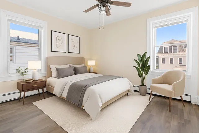 a bedroom with a large bed and a couch