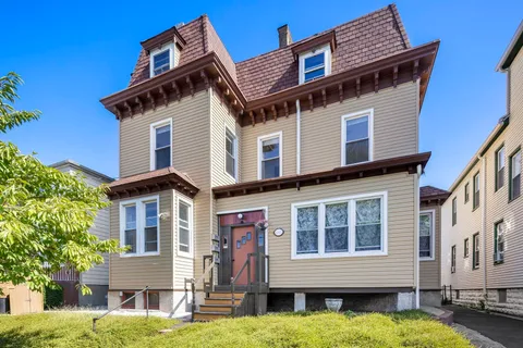 a front view of a building with a yard