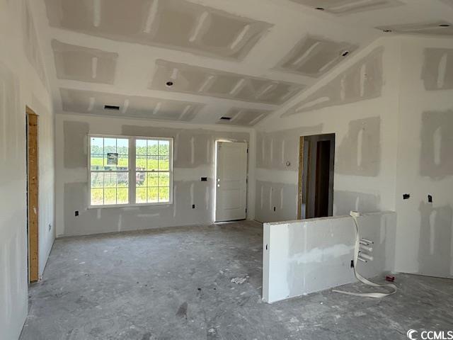 6692 Joyner Swamp Road Aynor, SC 29511 - Photo 4 of 16 Empty room featuring lofted ceiling