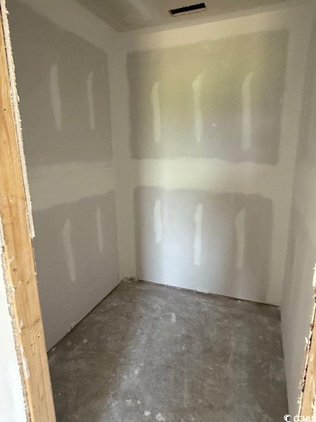 6692 Joyner Swamp Road Aynor, SC 29511 - Photo 7 of 16 Empty room with unfinished concrete floors