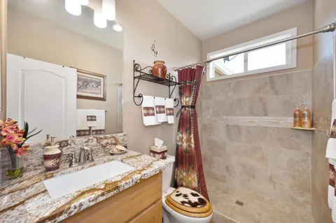 a view of a house with backyard and porch