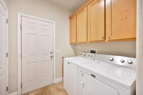 a view of yard with swimming pool and green space