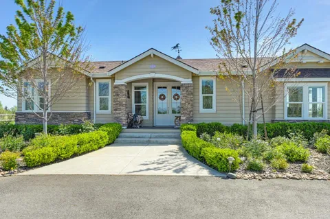 a spacious bedroom with a bed and a table