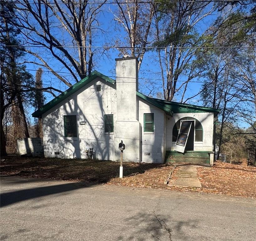 1096 3rd Street Northwest Atlanta, GA 30318 - Photo 1 of 17 a front view of a house with a yard